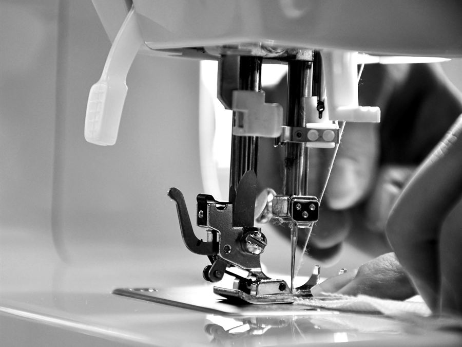 Guiding fabric through an industrial machine
